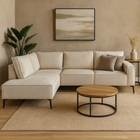 Beige hoekbank met zwarte stalen poten.