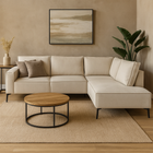 Beige hoekbank met zwarte stalen poten.
