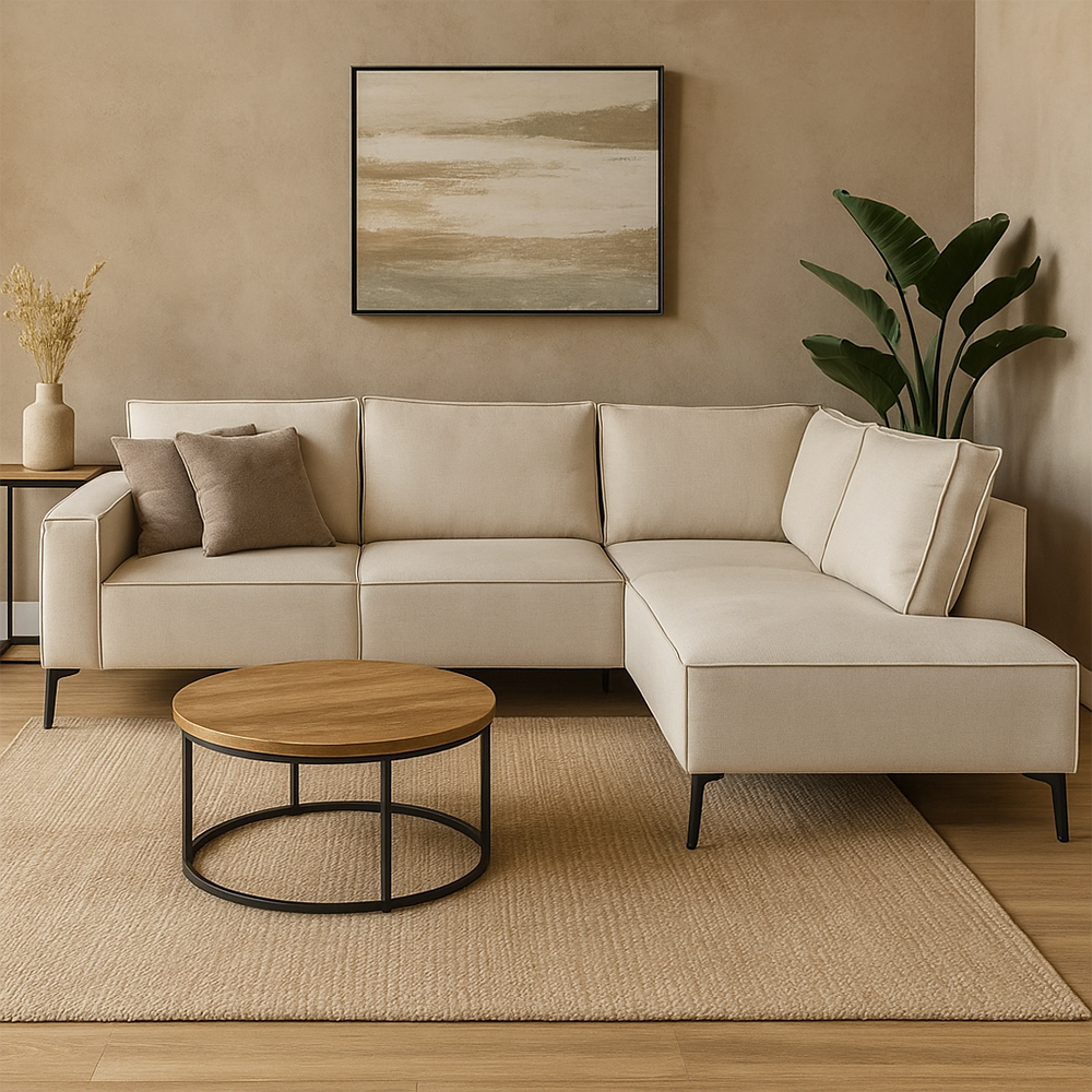 Beige hoekbank met zwarte stalen poten. 