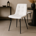 Crème/witte eetkamerstoel met zwart onderstel.