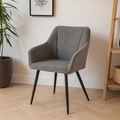 eetkamerstoel van grijs linnen met zwart onderstel