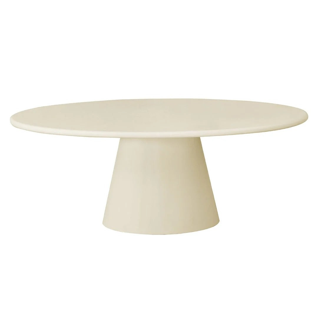 Ovale beige eettafel van microcement